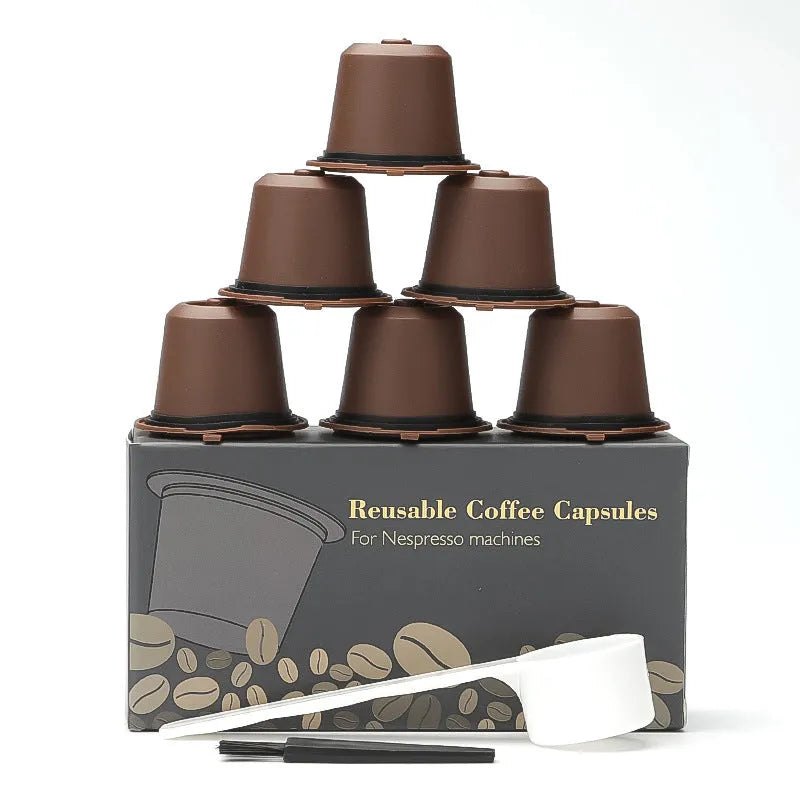 Set of six recyclable reusable plastic coffee filter cups in black, brown, and red with a spoon on wooden background