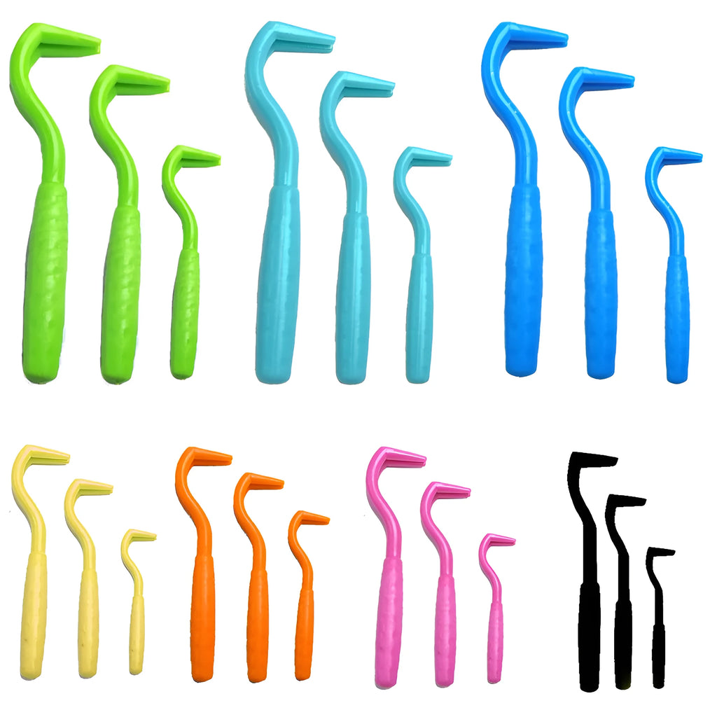 Three coloured plastic tick hook tools for removing ticks from dogs.