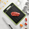Grey square aluminium cutting board with double-sided design showing thawing surface and integrated knife sharpener
