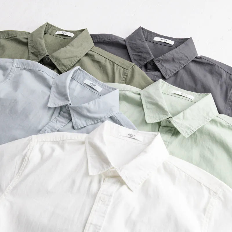 Man wearing a loose-fit light blue pure cotton short sleeve casual shirt.
