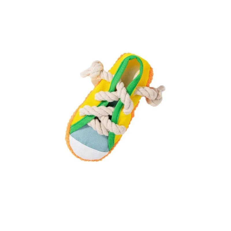Yellow plastic dog chew toy shaped like slippers, with a sound mechanism for pet play.