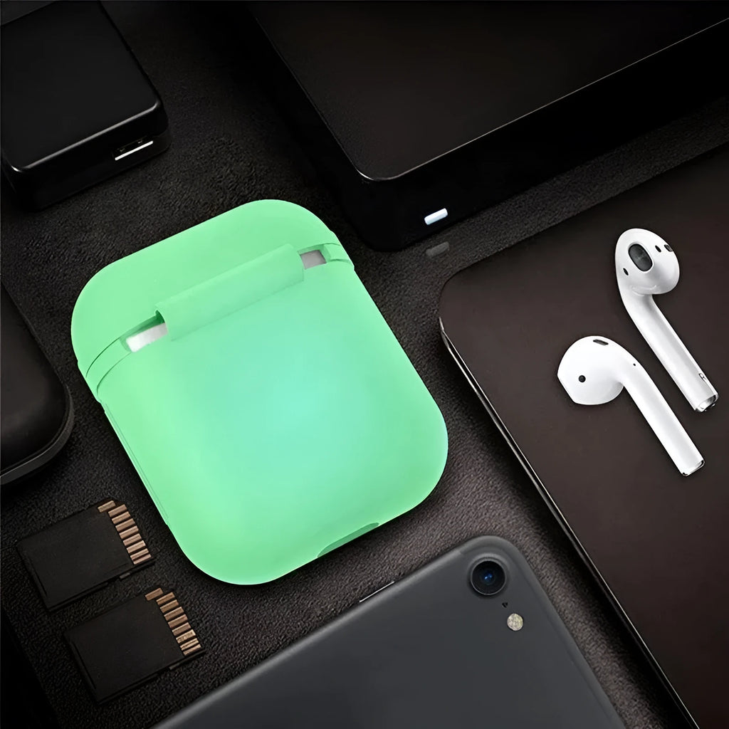 Glow-in-the-dark silicone flip-top protective case for Apple AirPods on a dark background
