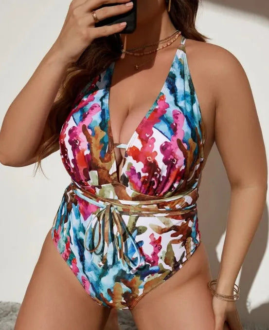 Women's solid blue one-piece halter neck swimsuit with briefs bottom on a mannequin