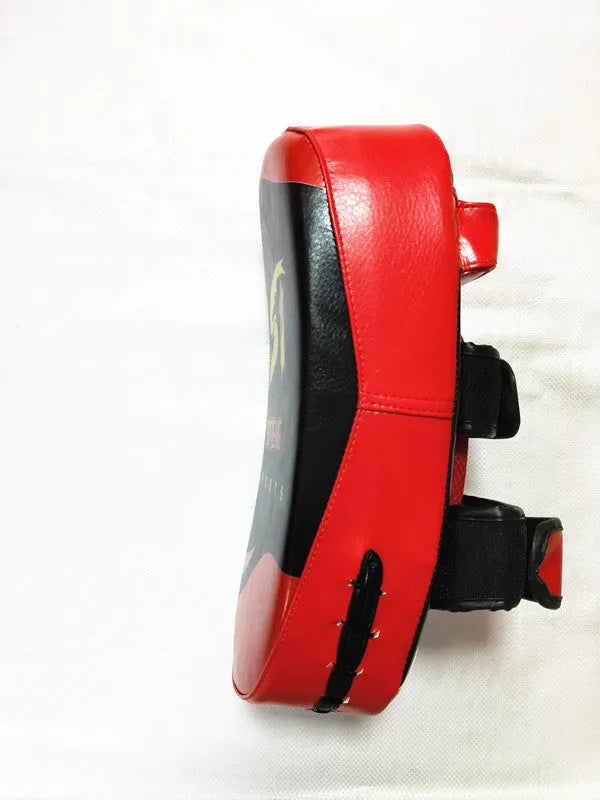 Black and red square hand-held boxing foot target pad with a rear buckle.