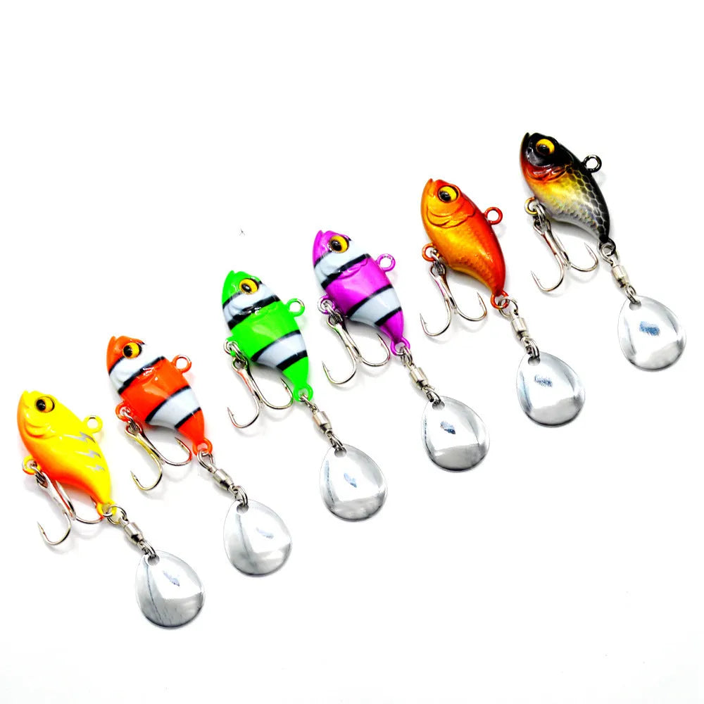 Metal sea fishing lure with a rotating sequin in zebra orange, mesh black, and gold colour variants.