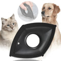 Handheld silicone pet hair removal brush in red on a carpet