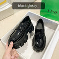 British style wide fit loafers in matte or patent leather with a rubber sole and muffin heel.