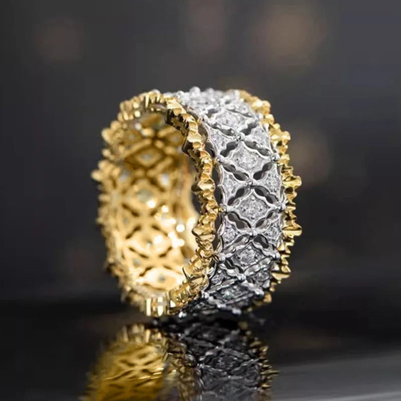 Geometric round two-tone gold zircon ring on a copper band.