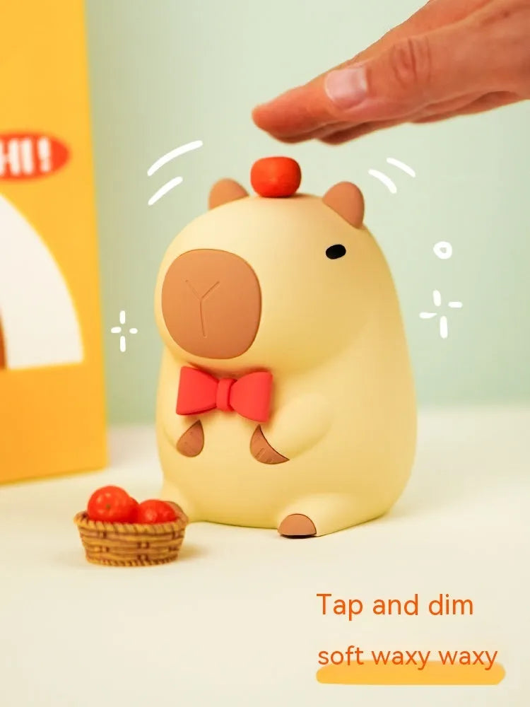Cute capybara-shaped small night lamp on a table, showing its size and design.