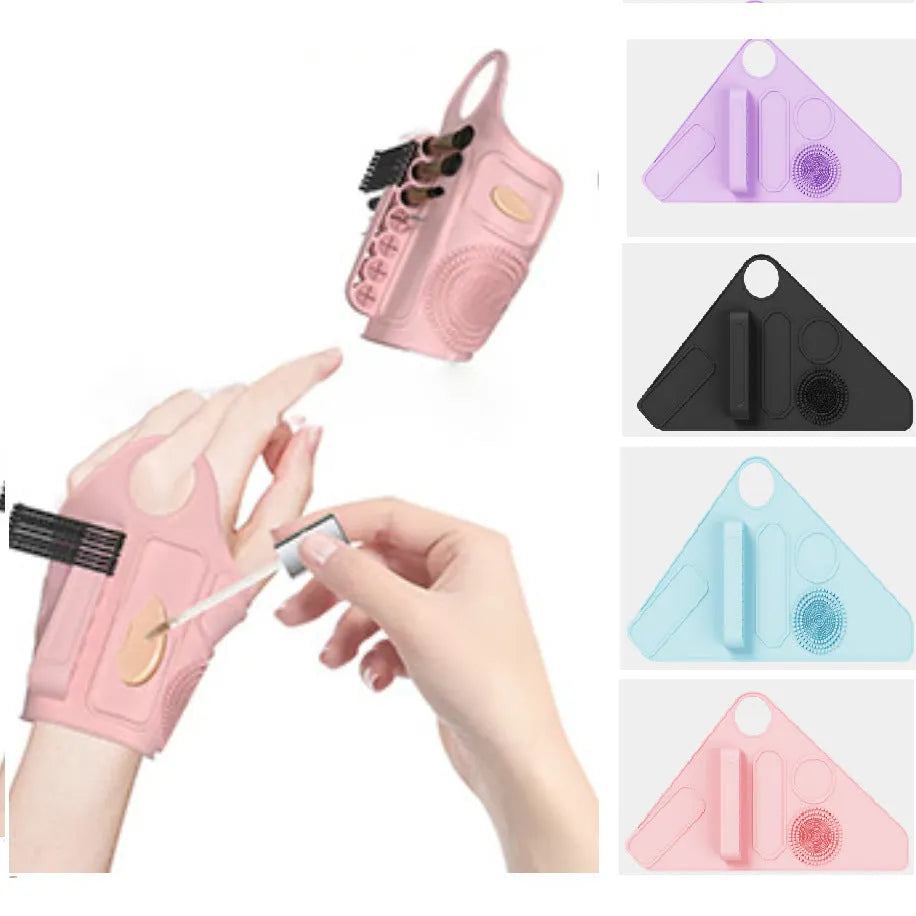 Silicone makeup auxiliary hand strap in four colours: purple, pink, blue, and black, on a light background showing regular size and flexible material.