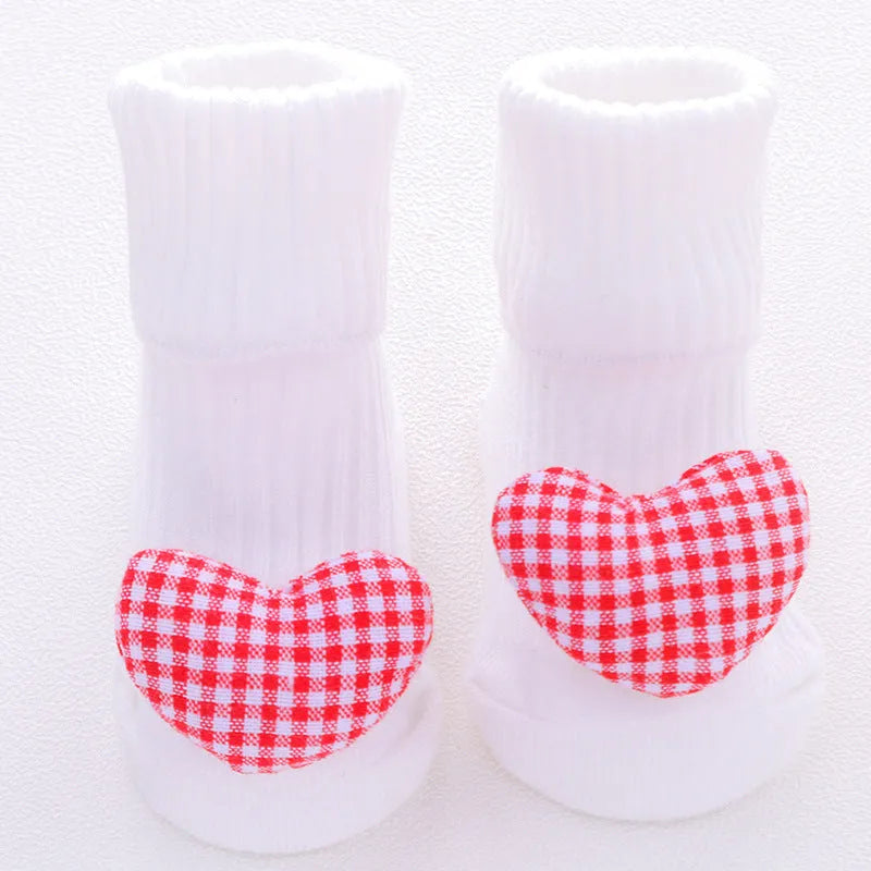Cotton baby socks in various colours and patterns including bows, stars, and animal designs