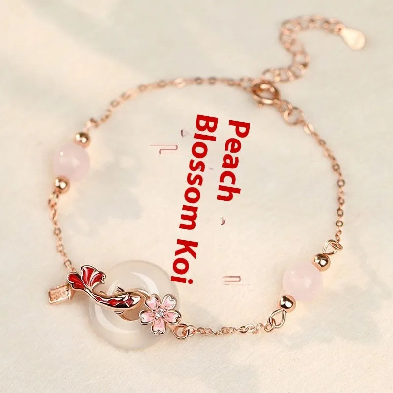 S925 sterling silver bracelet with white chalcedony crystal in a flower and koi pattern design.