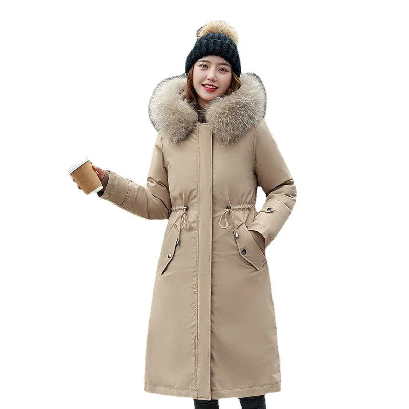 Women's long beige trench coat with two-way zip and cotton padding, shown in extended length.