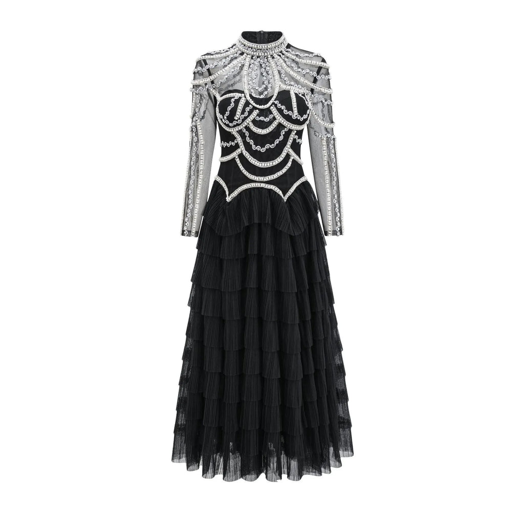 Women's black long sleeve beaded dress with a mid waist and long skirt.