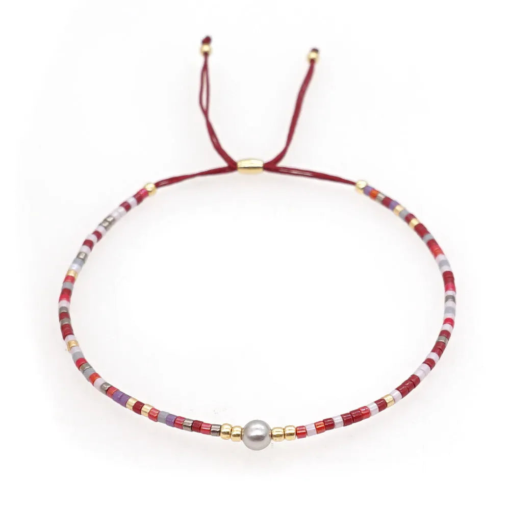 Handmade Bohemian style beaded bracelet with geometric glass and coloured glaze beads in various colours