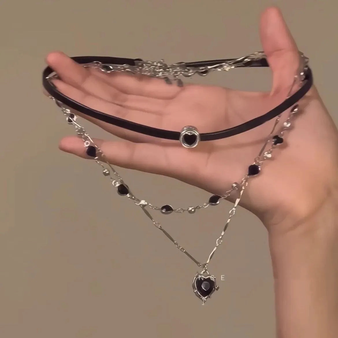 Women's adjustable multi-layer twin necklace with a leather loving heart pendant and crystal accents.