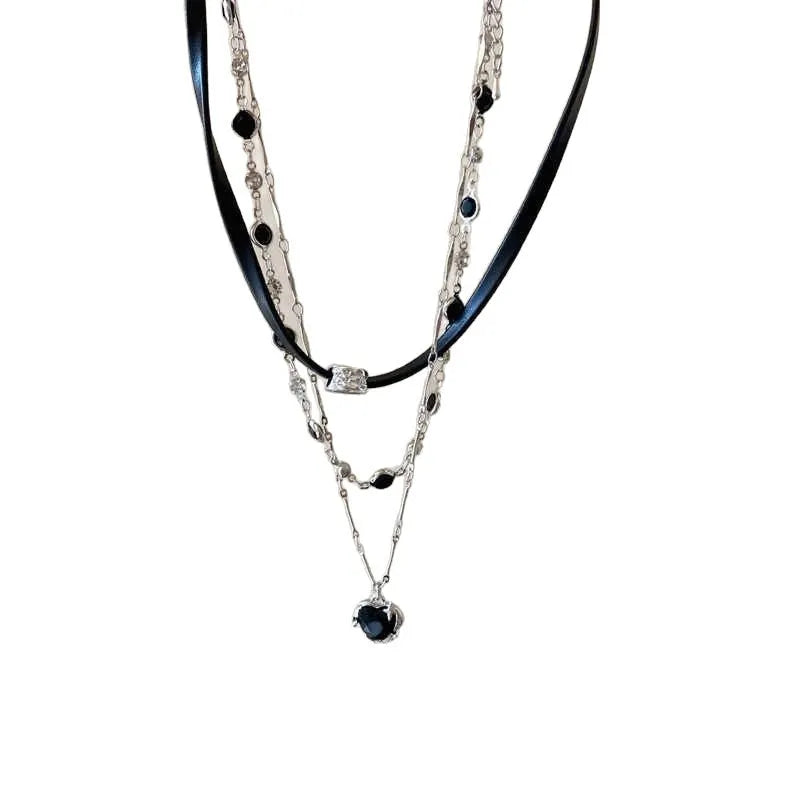 Women's adjustable multi-layer twin necklace with a leather loving heart pendant and crystal accents.
