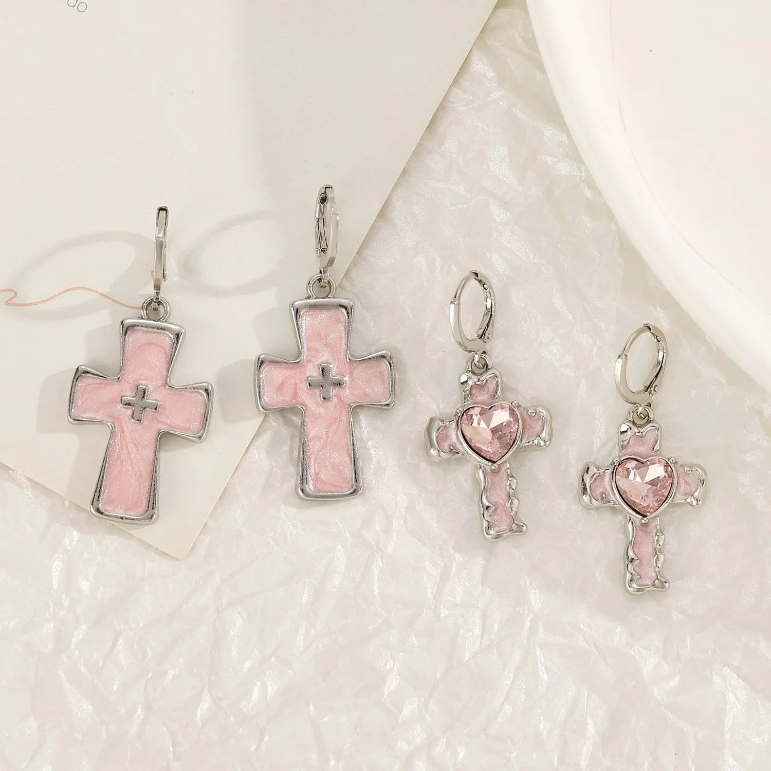 Women's classic cross crystal alloy earrings showing five colour options with cross and heart design elements