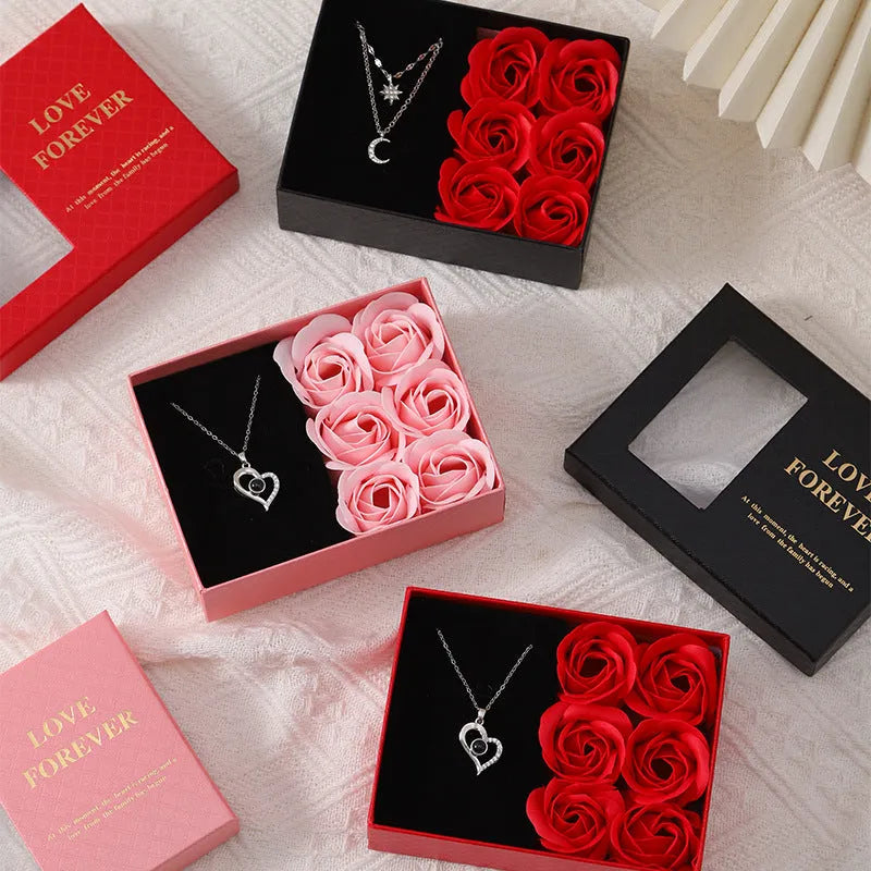 Six red soap roses in a black Korean-style gift box with a matching handbag