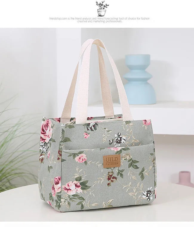 Women's large printed canvas tote bag with aluminium hardware in a horizontal square shape.