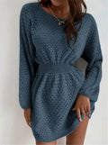 Blue women's knitted dress with crocheted flower details on the front.