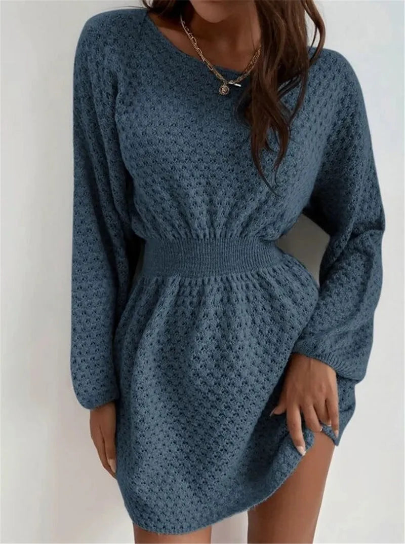 Blue women's knitted dress with crocheted flower details on the front.