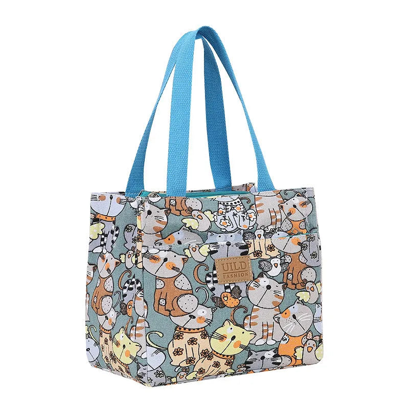 Women's large printed canvas tote bag with aluminium hardware in a horizontal square shape.