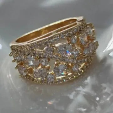 Round hollow women's fashion ring in copper, shown in platinum white and gold blue colour options.