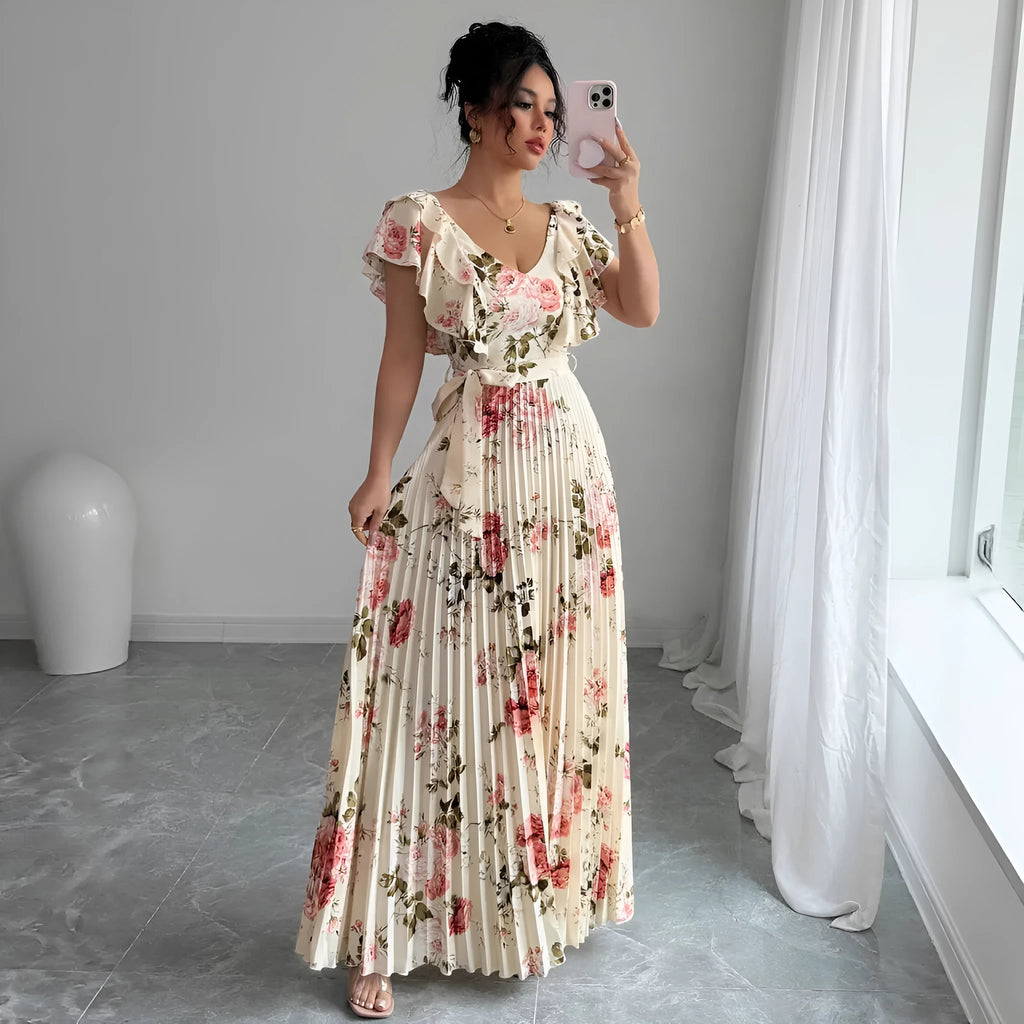 Apricot-coloured women's V-neck floral print dress with ruffled short sleeves and a long, pleated oversized swing skirt.