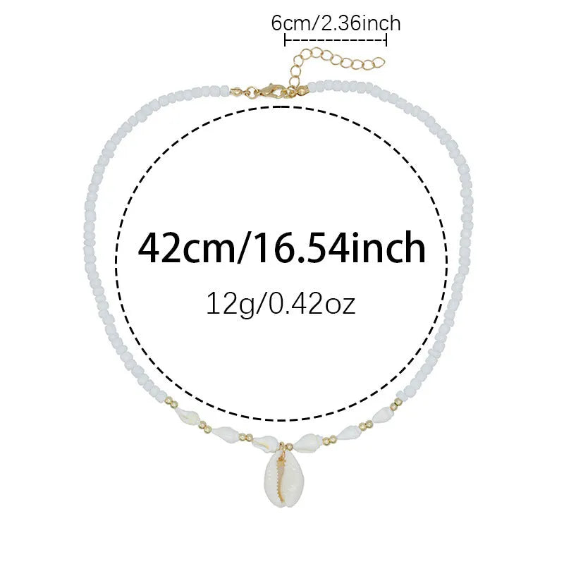 White necklace with a natural shell and mother of pearl pendant on a regular chain.