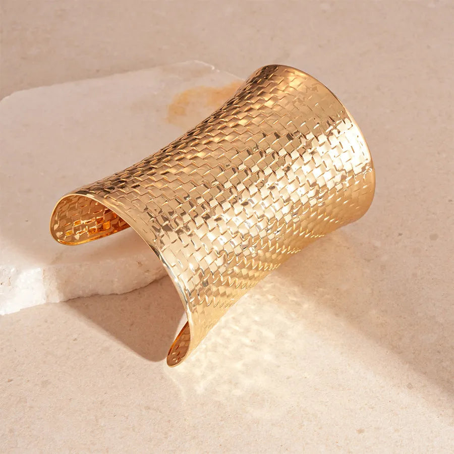 Women's vintage metal bracelet with exaggerated round design in gold colour.