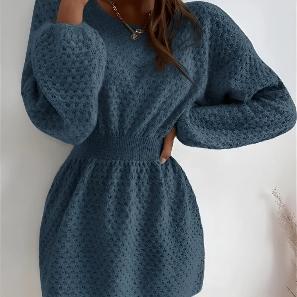 Blue women's knitted dress with crocheted flower details on the front.