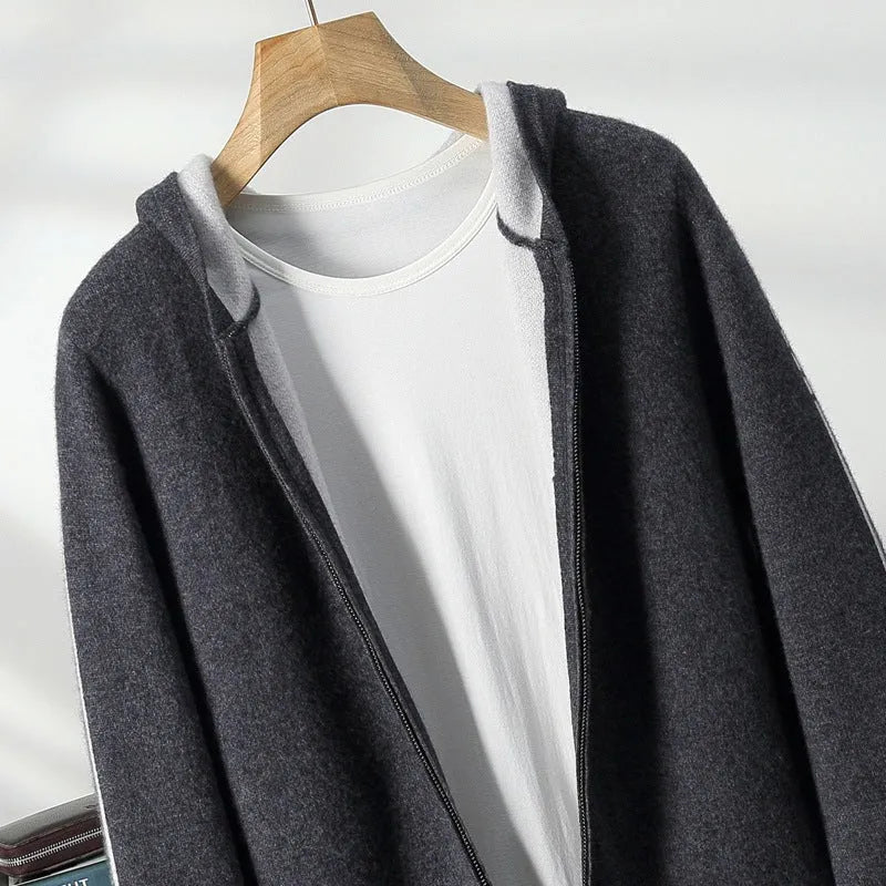 Man wearing a dark blue cashmere cardigan with a half-high collar and zippered front.