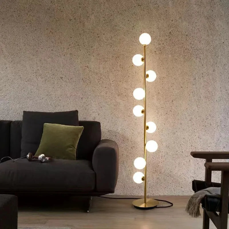 Tall minimalist Nordic floor lamp with wrought iron stand, glass details, and a marble foundation base.