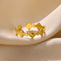 Golden diamond colour titanium steel geometric women's ring on display