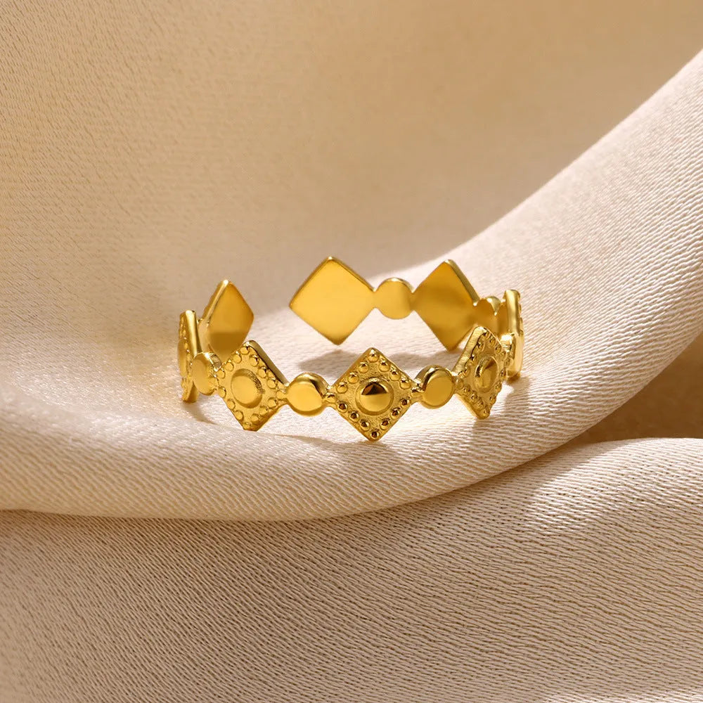 Golden diamond colour titanium steel geometric women's ring on display