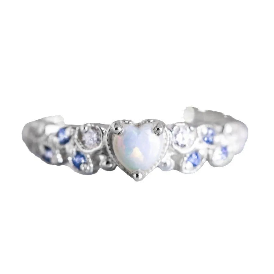 Women's peach-coloured heart-shaped alloy ring with a flower opal ocean pattern on its face.