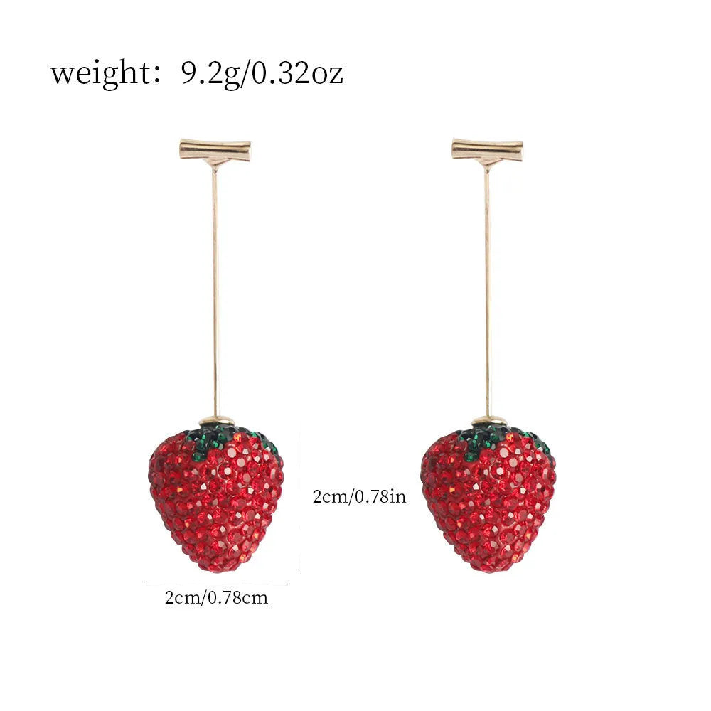 Close-up of women's geometric strawberry-shaped earrings with spot drill texture, on a red background.