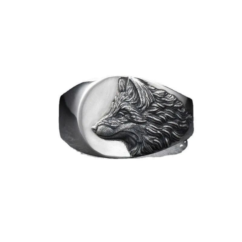 Men's silver geometric wolf head alloy ring on a black background, showing side and top views.