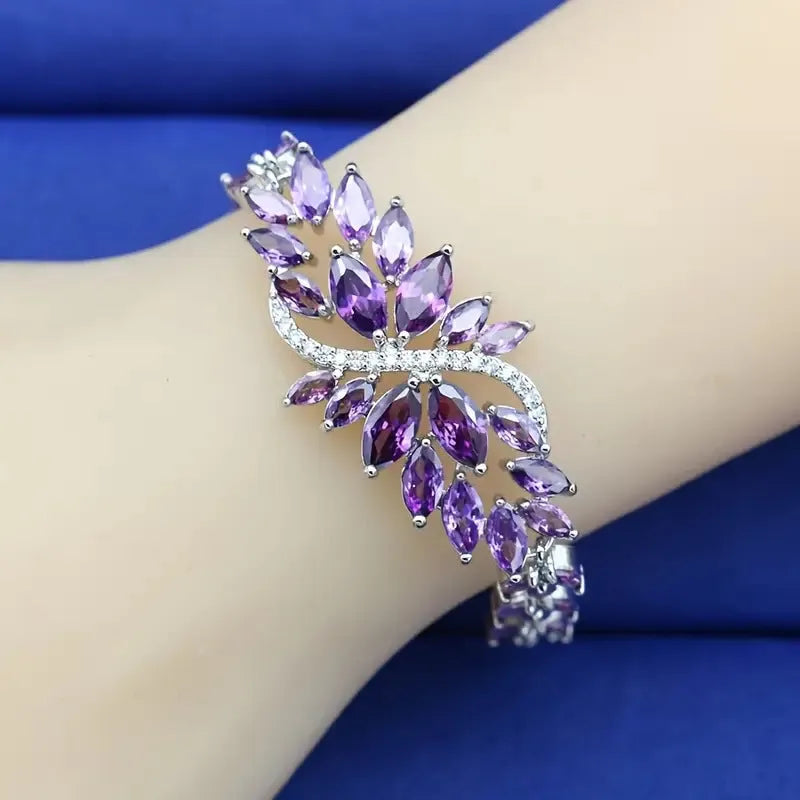 Gold-plated copper bracelet with coloured zircon stones in an ice flower design.