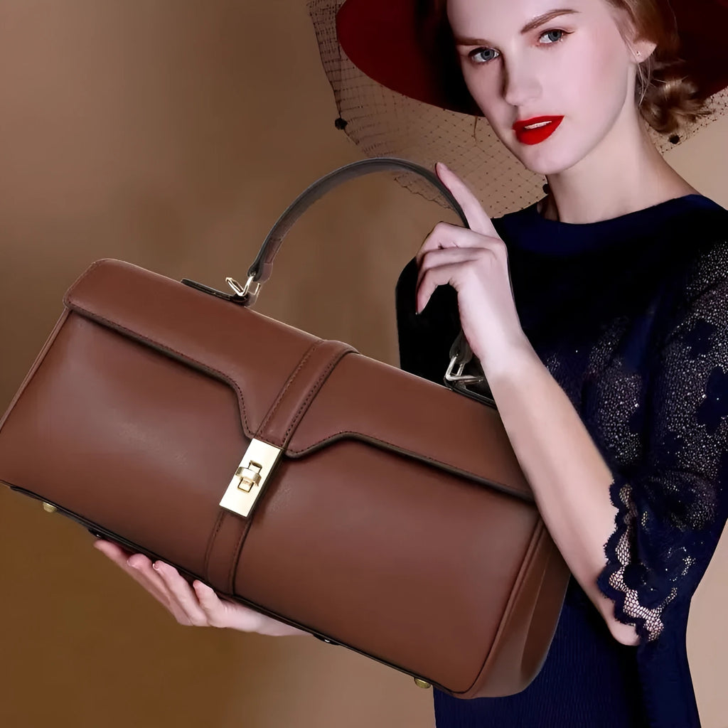 Genuine cowhide leather women's messenger bag in cylindrical suitcase shape with internal organisation compartments