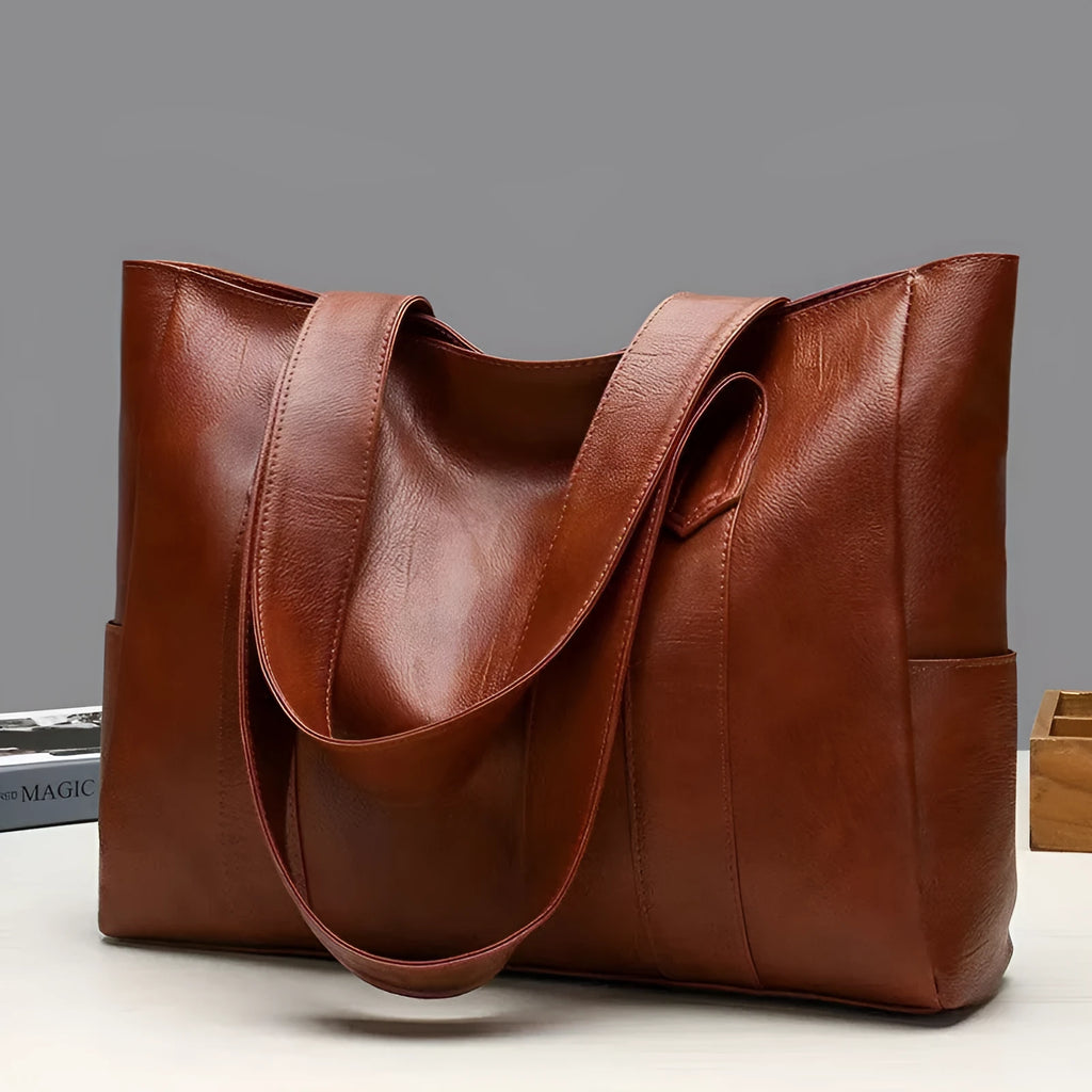 Soft PU horizontal square tote bag with double shoulder straps, black colour, sewing thread detail, and sandwich pocket