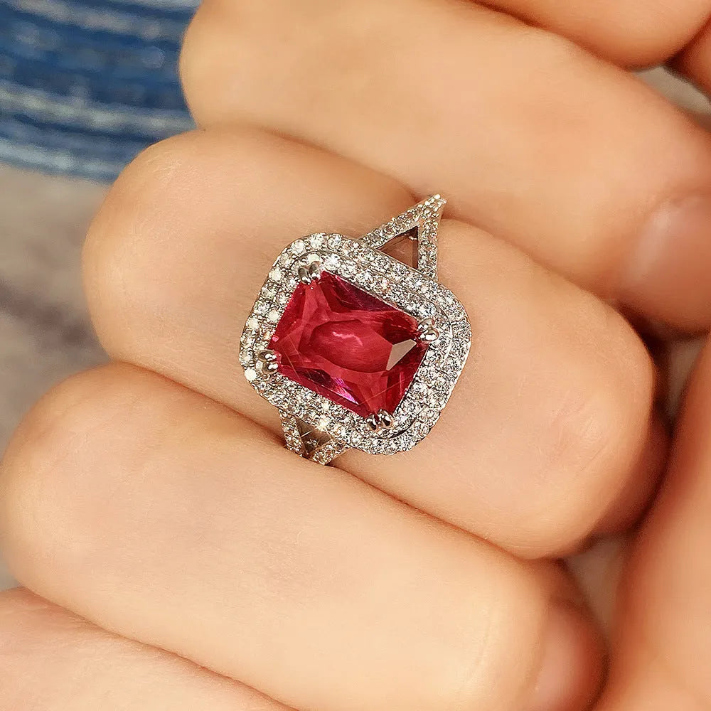 Women's copper square ring with red rhinestones, shown in a geometric princess cut design.