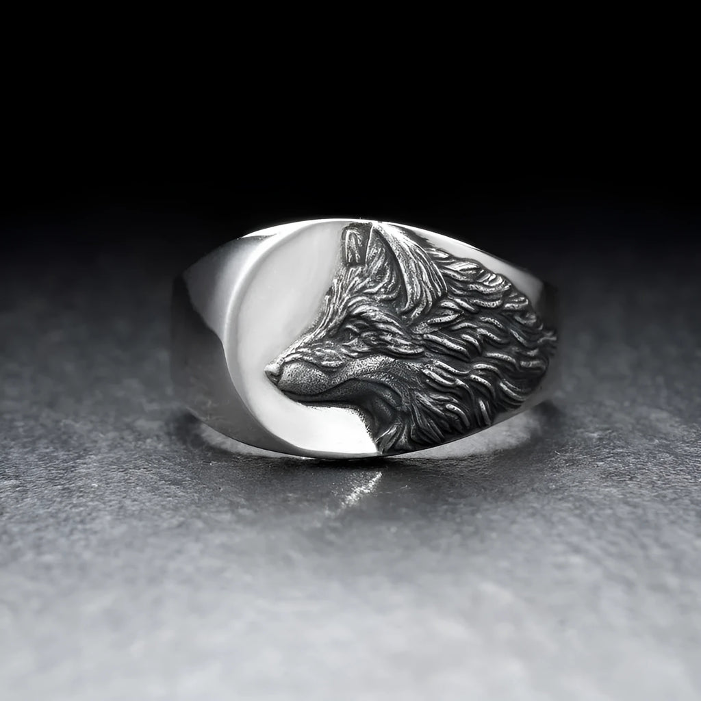 Men's silver geometric wolf head alloy ring on a black background, showing side and top views.
