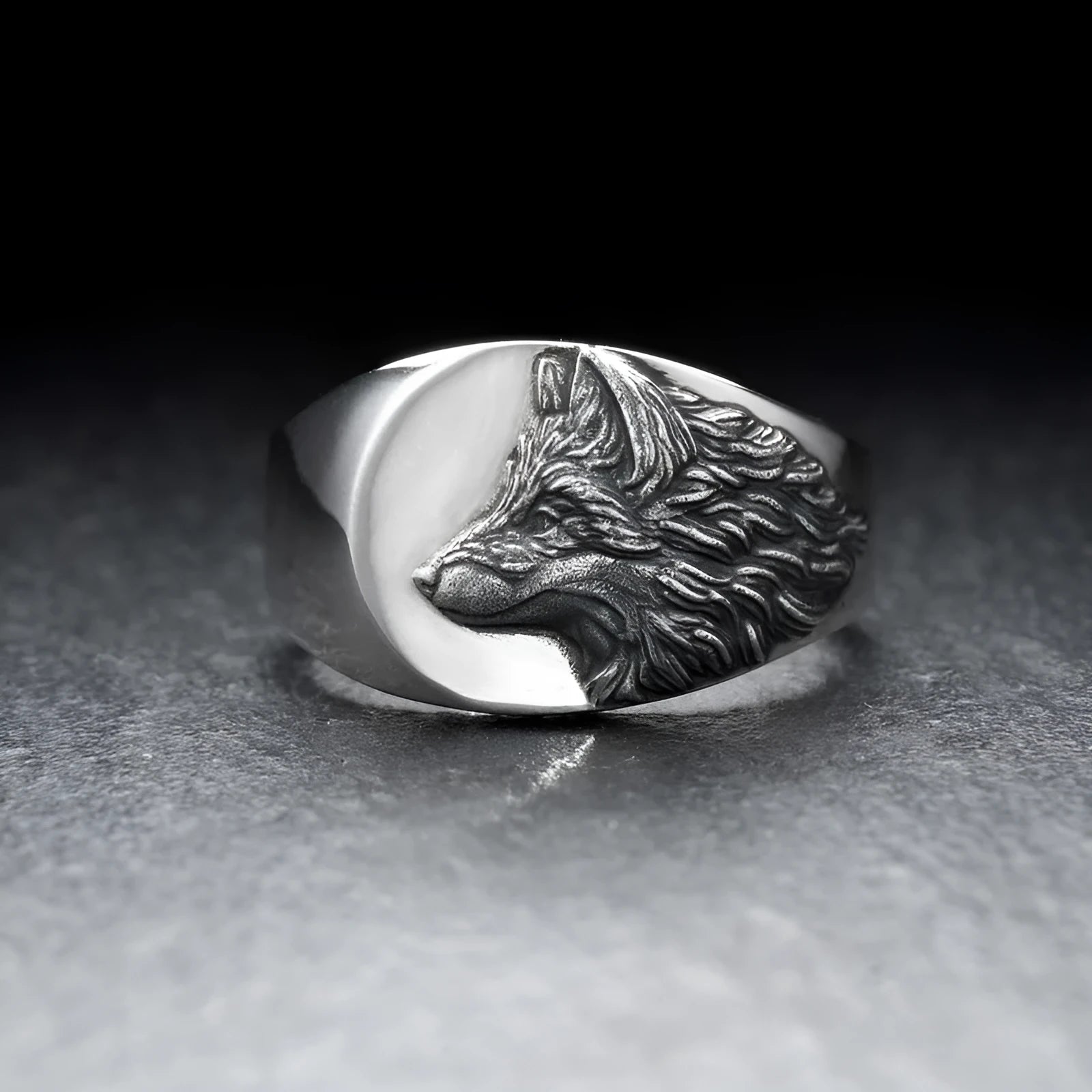 Men's silver geometric wolf head alloy ring on a black background, showing side and top views.