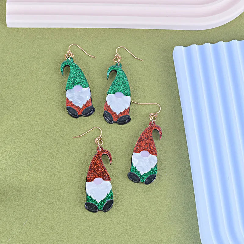 Santa Claus cartoon character acrylic fashion earrings on red, green, and mixed backgrounds.