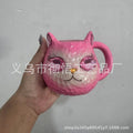 Small solid-colour resin cat cup craft figurine on a table, shown in purple, green, blue, and pink colour variants.