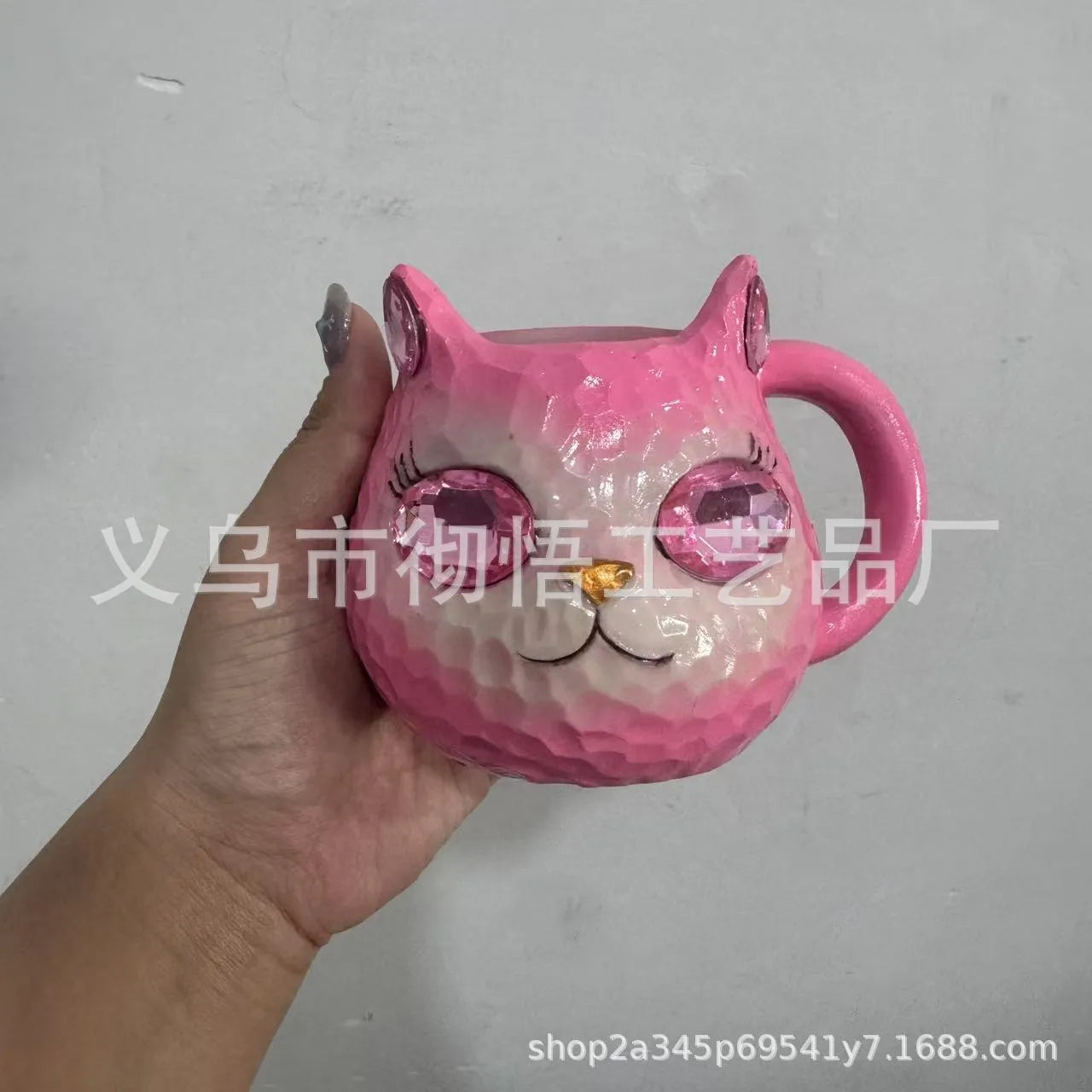 Small solid-colour resin cat cup craft figurine on a table, shown in purple, green, blue, and pink colour variants.