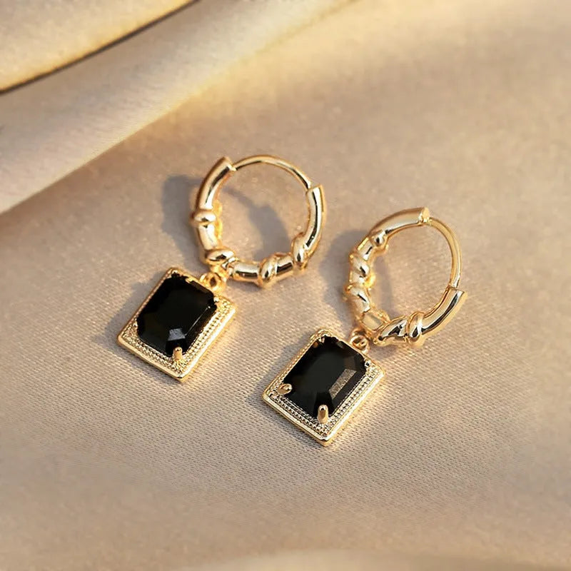 Close-up of women's black zircon geometric earrings made from solid copper with a quadrilateral design.