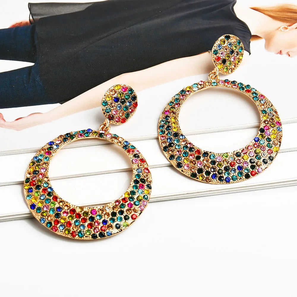Coloured cartoon-style alloy earrings with a large round pendant and diamond design.